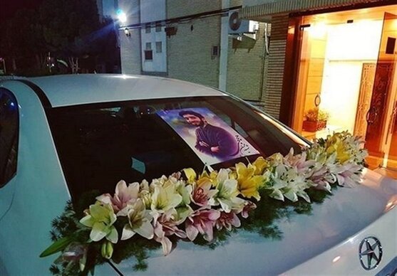 ماشین‌عروس مزین به عکس شهید حججی