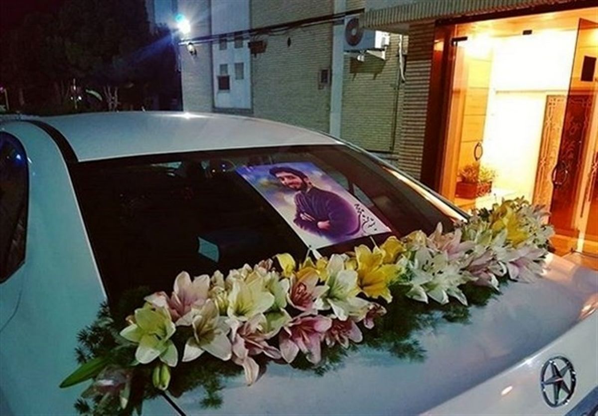 ماشین‌عروس مزین به عکس شهید حججی